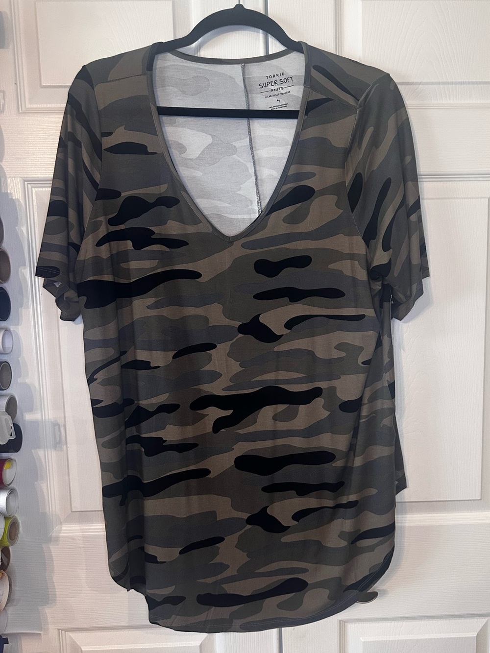 Try:  
Torrid Super Soft Brushed Camo Tunic 4X NWT